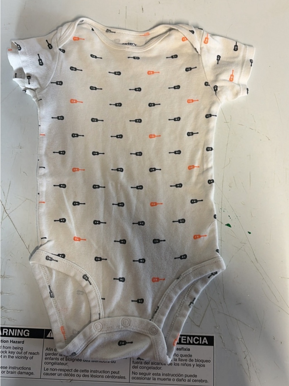 Carter’s size 18 month guitar onesie